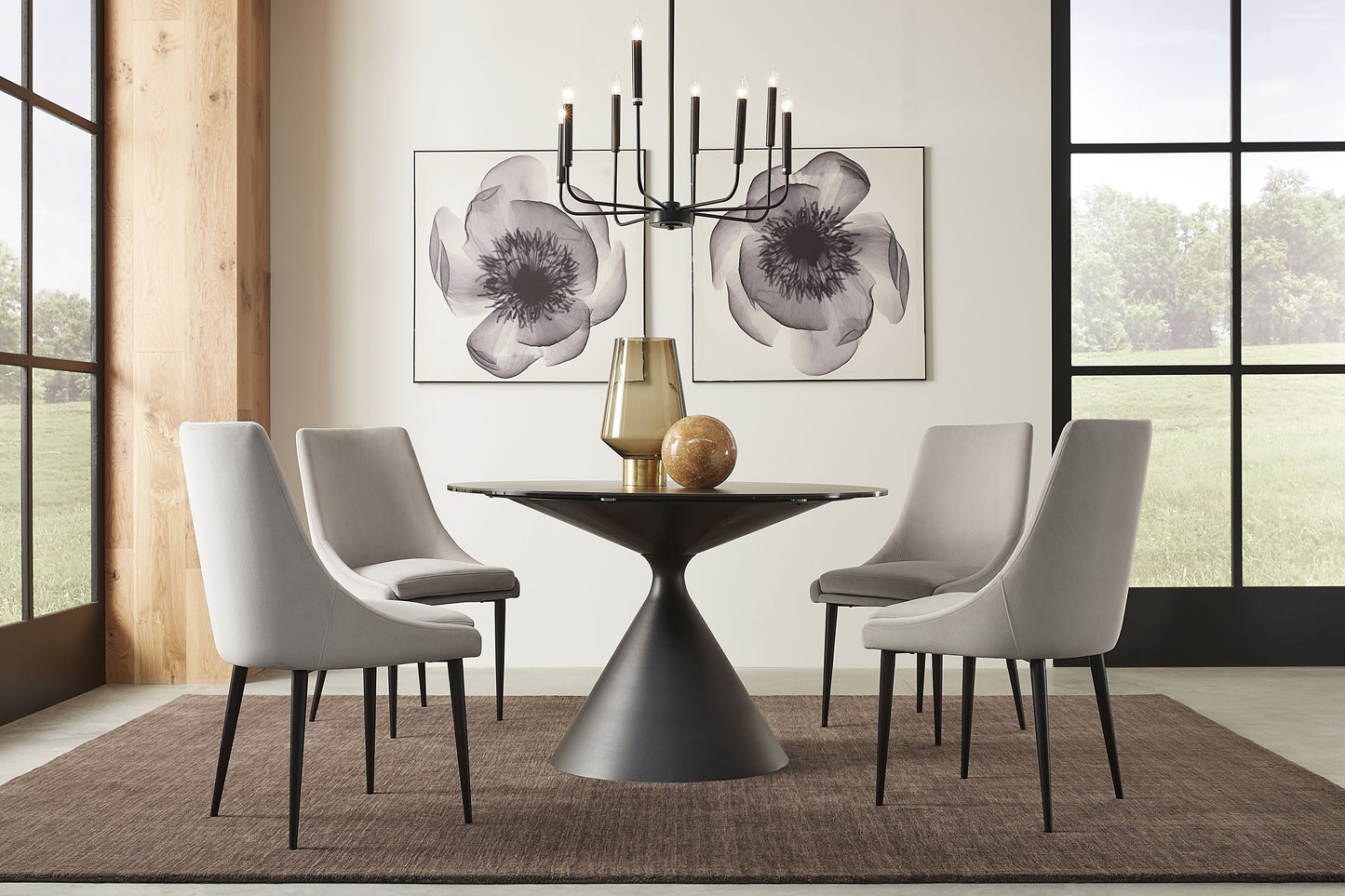 Winston - Rundt spisebord  med sten top og metal base i sort.